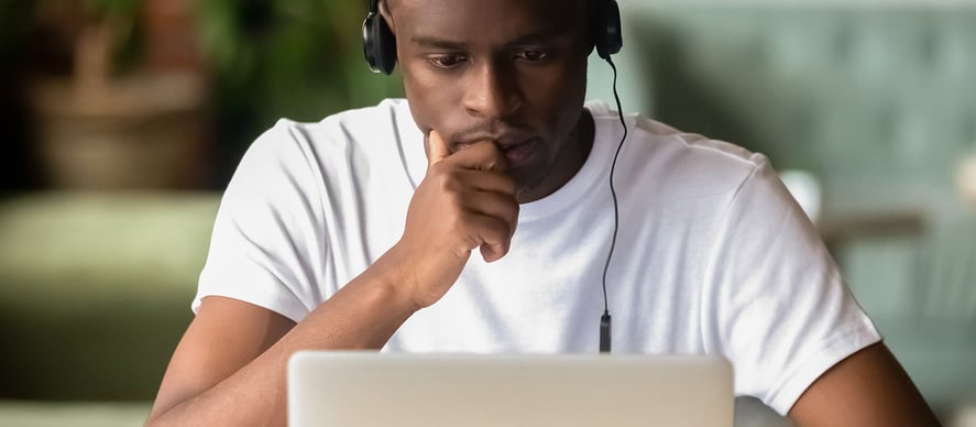 Student on the computer in a pensive state. What options does a gap year offer?